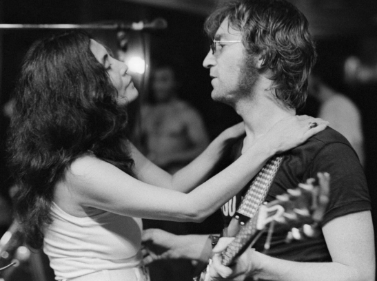 John Lennon Holding Guitar and His Lover